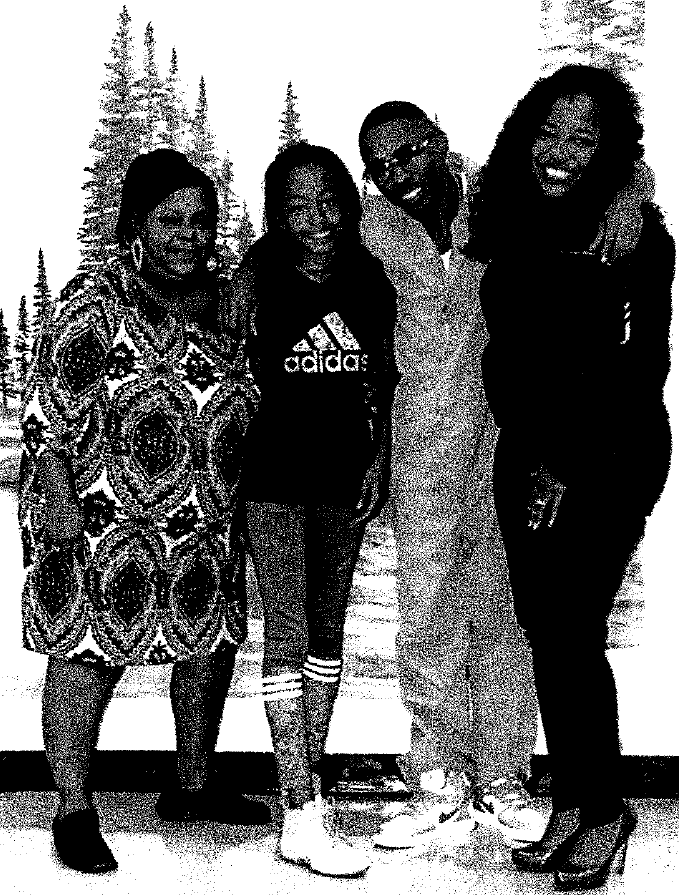 Photo of Corvain Cooper with family